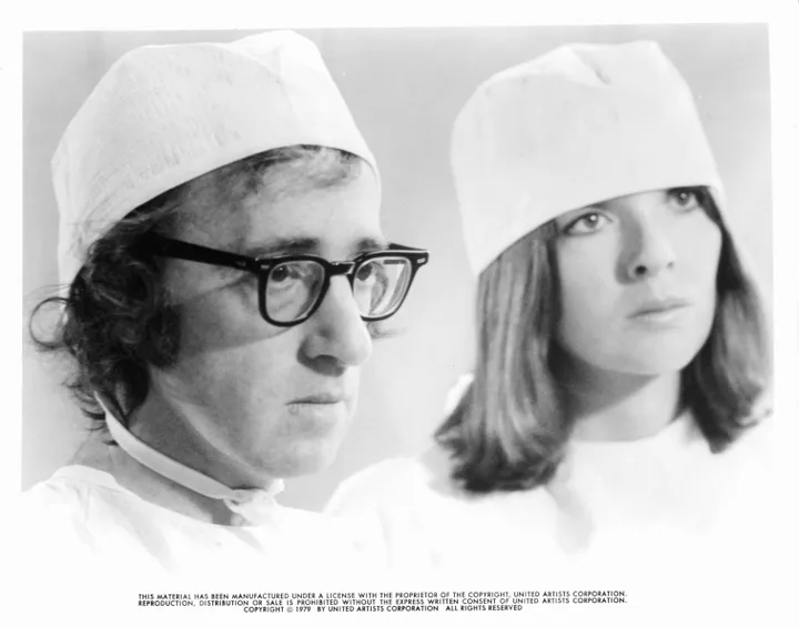 Woody Allen and Diane Keaton in surgical gear in a scene from the film 'Sleeper', 1973. (Photo by United Artists/Getty Images)